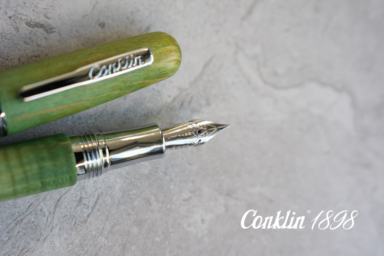 Premium Conklin fountain pen showcasing natural stabilized wood craftsmanship
